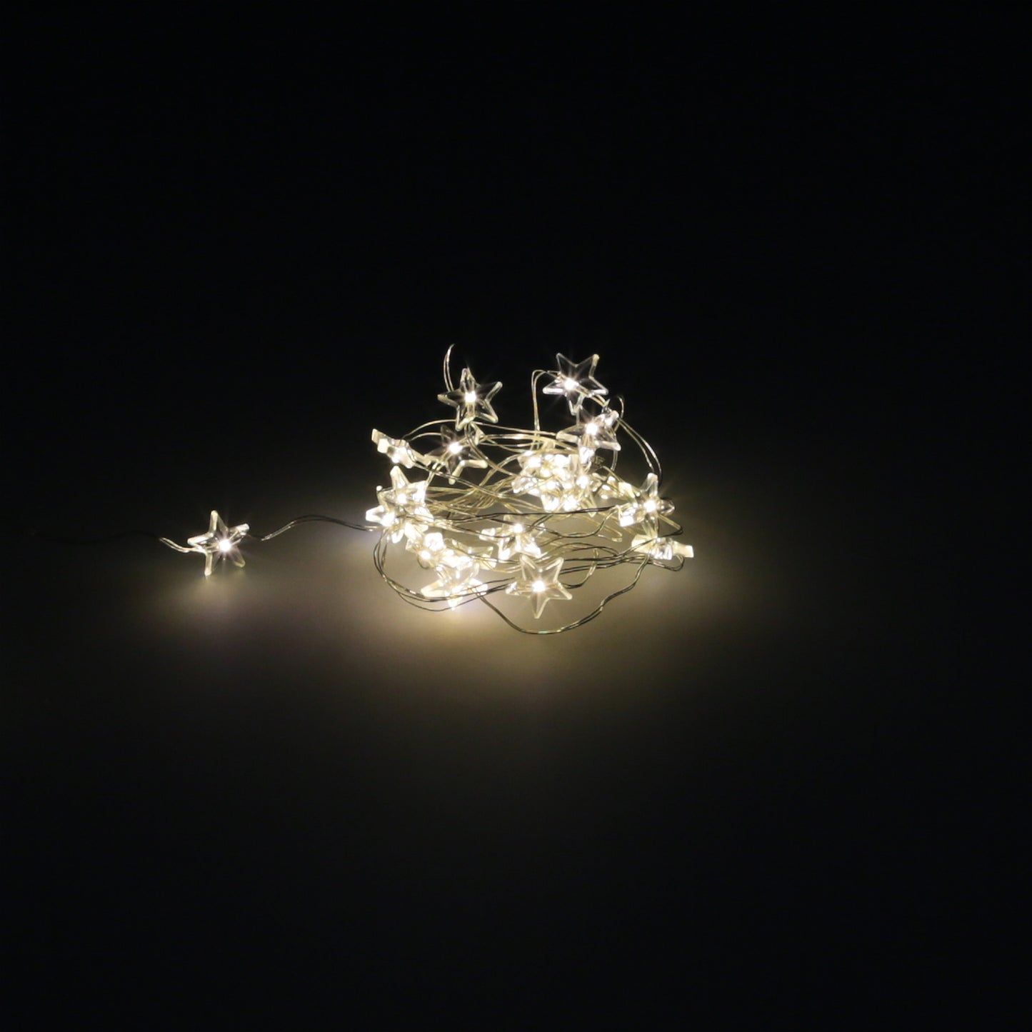 Guirlanda Luzes de Natal Estrelas 20 Leds Cor Branco Quente. Luz de Natal interna e externa IP44 A 3AA Pilhas (não inclusas)